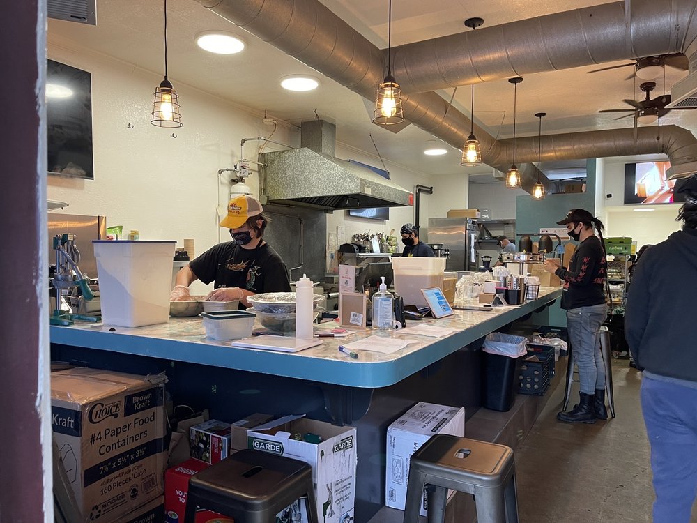 two person preparing food in restaurant kitchen
